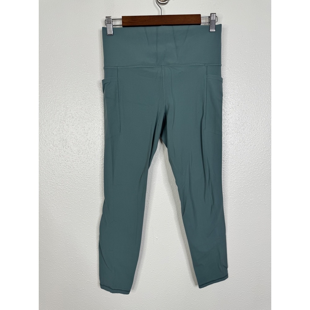 Athleta Salutation Stash Cinch 7/8 Tight Teal Blue Green Leggings Womens Medium‎